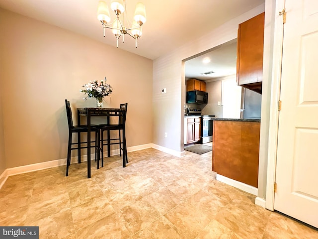 131 Arundel Rd, Pasadena, MD 21122 - dining area with a chandelier and baseboards