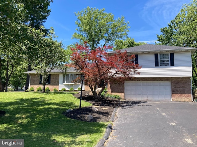 4117 Charley Forest St, Olney, MD 20832 - view of front facade featuring brick siding, asphalt driveway, an attached garage, and a front lawn