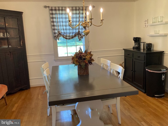 4117 Charley Forest St, Olney, MD 20832 - dining space featuring light wood-style flooring, a wainscoted wall, a chandelier, and a decorative wall