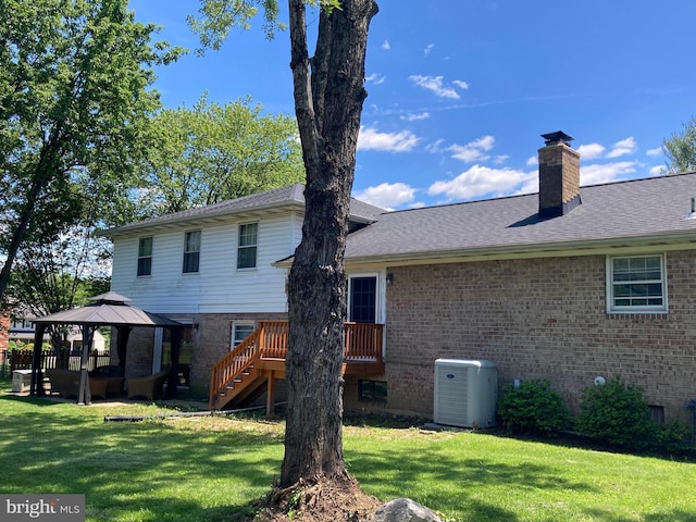 4117 Charley Forest St, Olney, MD 20832 - back of property with a gazebo, brick siding, a lawn, and stairs