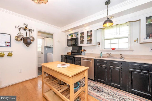4117 Charley Forest St, Olney, MD 20832 - kitchen featuring black appliances, a sink, ornamental molding, plenty of natural light, and light countertops