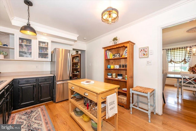 4117 Charley Forest St, Olney, MD 20832 - kitchen with freestanding refrigerator, open shelves, light countertops, light wood-style floors, and crown molding