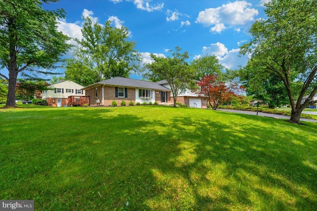 4117 Charley Forest St, Olney, MD 20832 - view of front of property featuring a garage, a front lawn, a deck, and brick siding