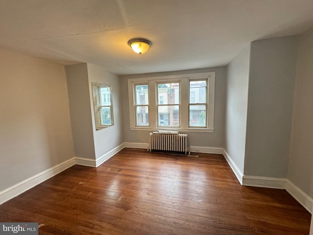 540 E Ashmead St, Philadelphia, PA 19144 - spare room featuring radiator heating unit, dark wood-style floors, and baseboards