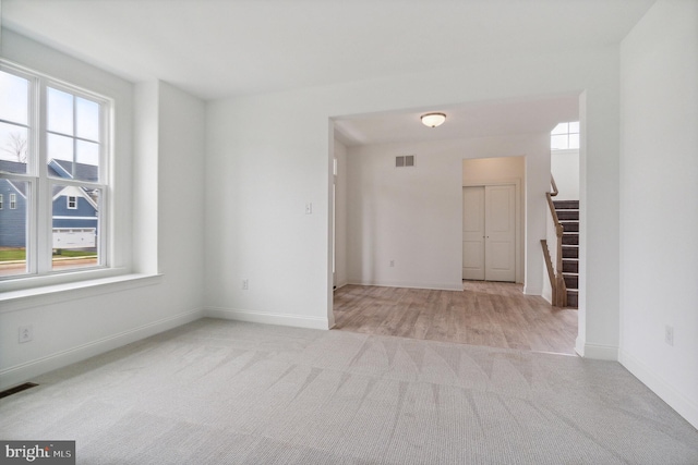4338 Taviston Ct E, Emmaus, PA 18049 - spare room featuring carpet floors, stairs, and baseboards