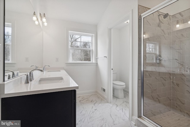 4338 Taviston Ct E, Emmaus, PA 18049 - full bath featuring double vanity, marble finish flooring, a shower stall, toilet, and baseboards
