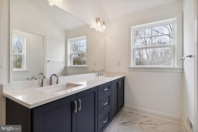 4338 Taviston Ct E, Emmaus, PA 18049 - bathroom featuring double vanity, marble finish floors, and baseboards