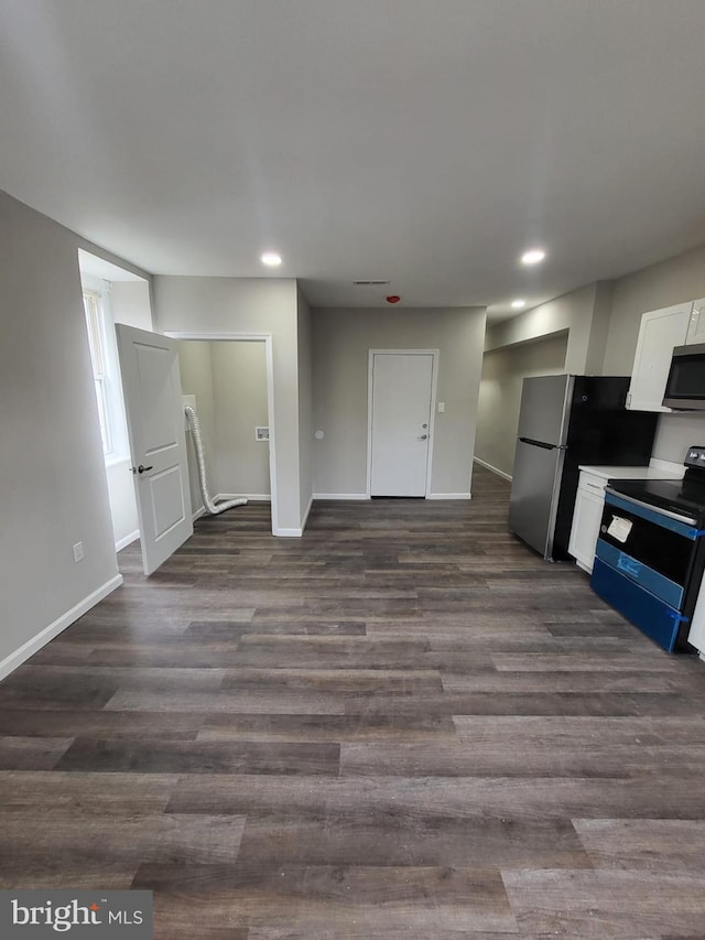 132 N 50th St, Philadelphia, PA 19139 - kitchen with appliances with stainless steel finishes, white cabinetry, baseboards, recessed lighting, and dark wood-style flooring