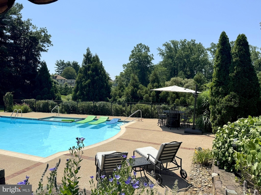 1017 Walsh Ln, Penn Valley, PA 19072 - community pool featuring a patio and a hot tub