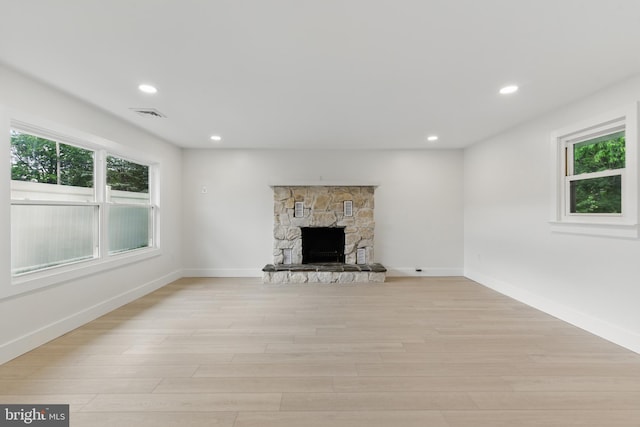 3835 Dresher Rd, Bensalem, PA 19020 - unfurnished living room with light wood-style floors, recessed lighting, baseboards, and a fireplace