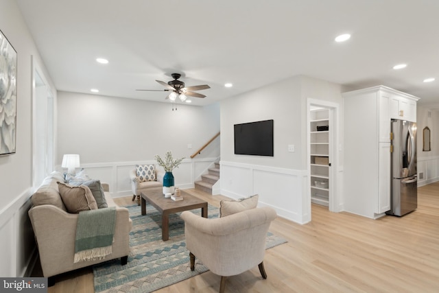 925 Merrick Ave, Haddon Twp, NJ 8108 - living area with recessed lighting, a decorative wall, wainscoting, light wood finished floors, and stairs