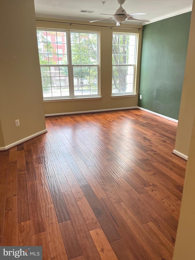 2720 Bellforest Ct Unit 201, Vienna, VA 22180 - empty room with ceiling fan, ornamental molding, hardwood / wood-style floors, and baseboards