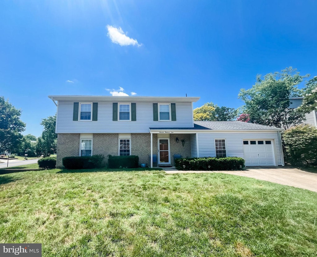 1901 Champlain Dr, Severn, MD 21144 - view of front of property featuring a garage, concrete driveway, and a front lawn