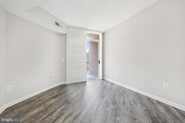 4480 Market Commons Dr Unit 416, Fairfax, VA 22033 - unfurnished room with dark wood finished floors and baseboards