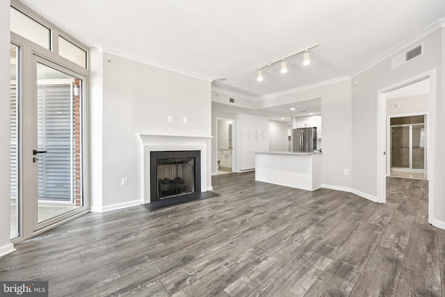 4480 Market Commons Dr Unit 416, Fairfax, VA 22033 - unfurnished living room with dark wood finished floors, ornamental molding, rail lighting, baseboards, and a fireplace with flush hearth