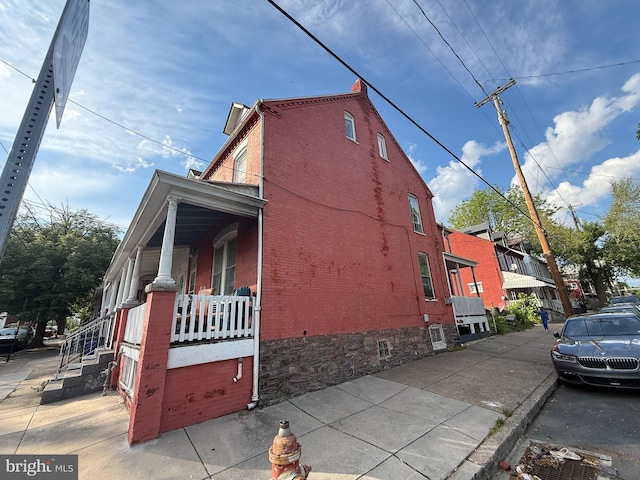 567 S Christian St, Lancaster, PA 17602 - view of home's exterior with brick siding and a porch
