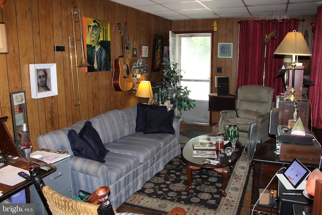 601 W Main St, New Holland, PA 17557 - living room featuring wooden walls and a paneled ceiling