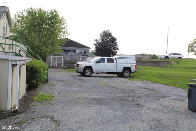 601 W Main St, New Holland, PA 17557 - view of car parking with a storage shed