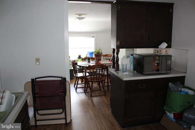 601 W Main St, New Holland, PA 17557 - kitchen featuring black microwave, dark wood-style flooring, and light countertops