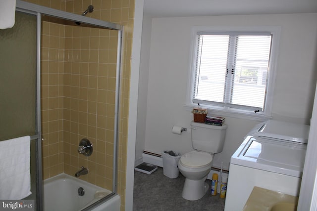 601 W Main St, New Holland, PA 17557 - bathroom featuring independent washer and dryer, baseboard heating, toilet, bath / shower combo with glass door, and a baseboard radiator