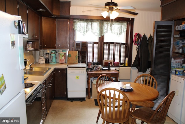 601 W Main St, New Holland, PA 17557 - kitchen with white appliances, a sink, a ceiling fan, dark brown cabinets, and washer / clothes dryer