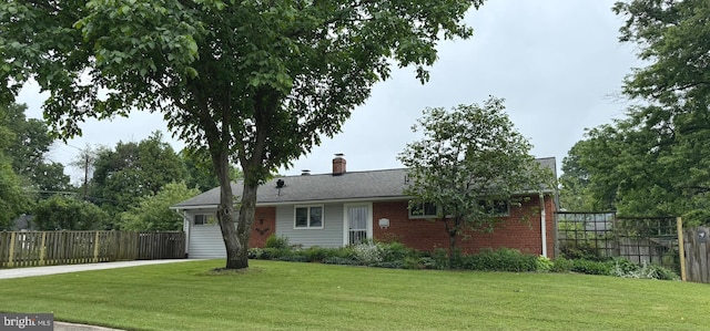 7200 Highland St, Springfield, VA 22150 - view of front of property featuring driveway, a chimney, and brick siding