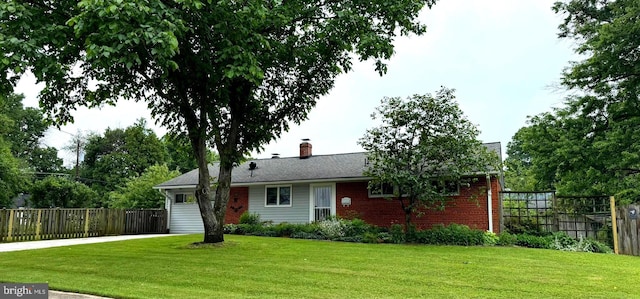 7200 Highland St, Springfield, VA 22150 - view of front of property featuring concrete driveway, brick siding, a chimney, and an attached garage