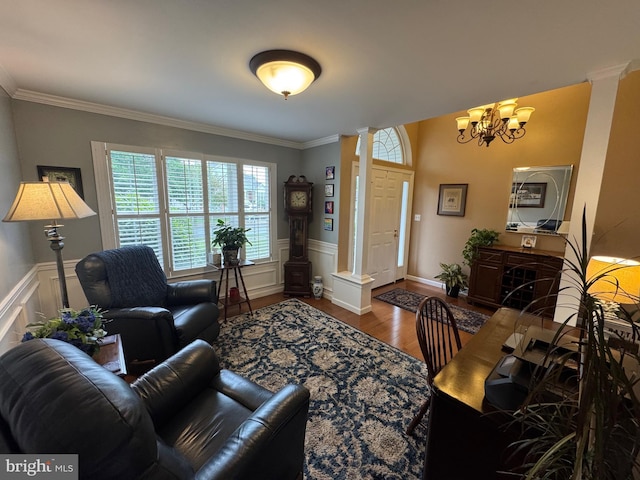 7 Red Fox Ct, Reinholds, PA 17569 - living room with decorative columns, wood finished floors, a chandelier, ornamental molding, and wainscoting