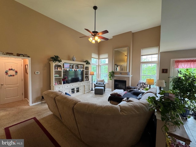 7 Red Fox Ct, Reinholds, PA 17569 - living room featuring high vaulted ceiling, light colored carpet, ceiling fan, a glass covered fireplace, and baseboards