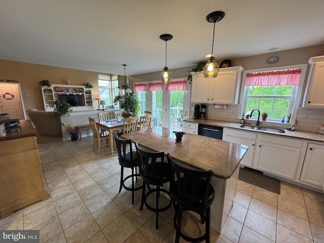 7 Red Fox Ct, Reinholds, PA 17569 - kitchen with a sink, black dishwasher, white cabinetry, and decorative backsplash