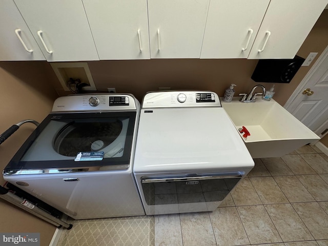 7 Red Fox Ct, Reinholds, PA 17569 - laundry area featuring washer and dryer, cabinet space, and tile patterned flooring