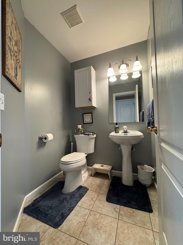 7 Red Fox Ct, Reinholds, PA 17569 - bathroom featuring toilet, baseboards, tile patterned floors, and lofted ceiling