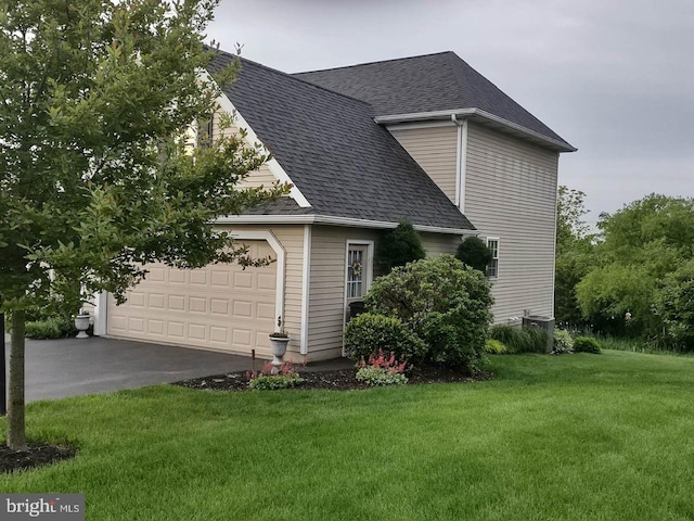 7 Red Fox Ct, Reinholds, PA 17569 - view of property exterior featuring a shingled roof, an attached garage, asphalt driveway, and a lawn