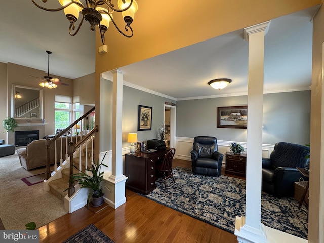 7 Red Fox Ct, Reinholds, PA 17569 - living room with ornate columns, wood finished floors, a glass covered fireplace, ornamental molding, and stairs