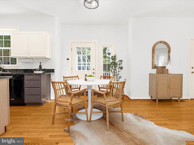 3501 Marthas Vineyard Way, Edgewater, MD 21037 - dining area with light wood-type flooring, healthy amount of natural light, and bar