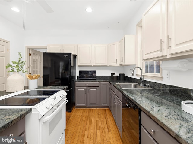 3501 Marthas Vineyard Way, Edgewater, MD 21037 - kitchen with black appliances, a sink, gray cabinets, light wood finished floors, and dark stone countertops