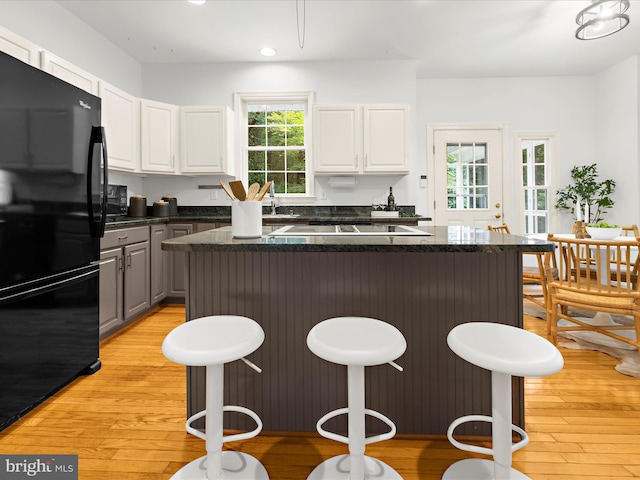 3501 Marthas Vineyard Way, Edgewater, MD 21037 - kitchen featuring freestanding refrigerator, a breakfast bar area, light wood-type flooring, white cabinetry, and recessed lighting