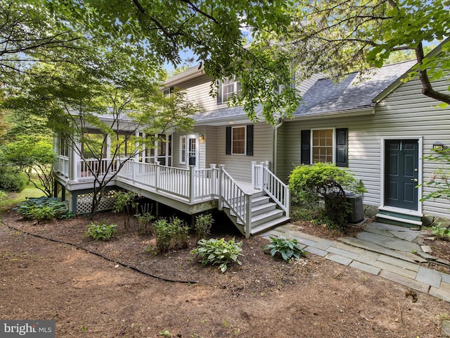 3501 Marthas Vineyard Way, Edgewater, MD 21037 - view of front of property with roof with shingles, central AC, and a wooden deck