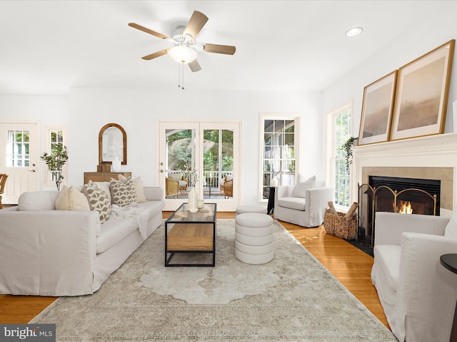 3501 Marthas Vineyard Way, Edgewater, MD 21037 - living room with light wood-type flooring, ceiling fan, healthy amount of natural light, a fireplace with flush hearth, and recessed lighting
