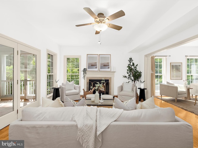 3501 Marthas Vineyard Way, Edgewater, MD 21037 - living area with ceiling fan, a fireplace, and wood finished floors