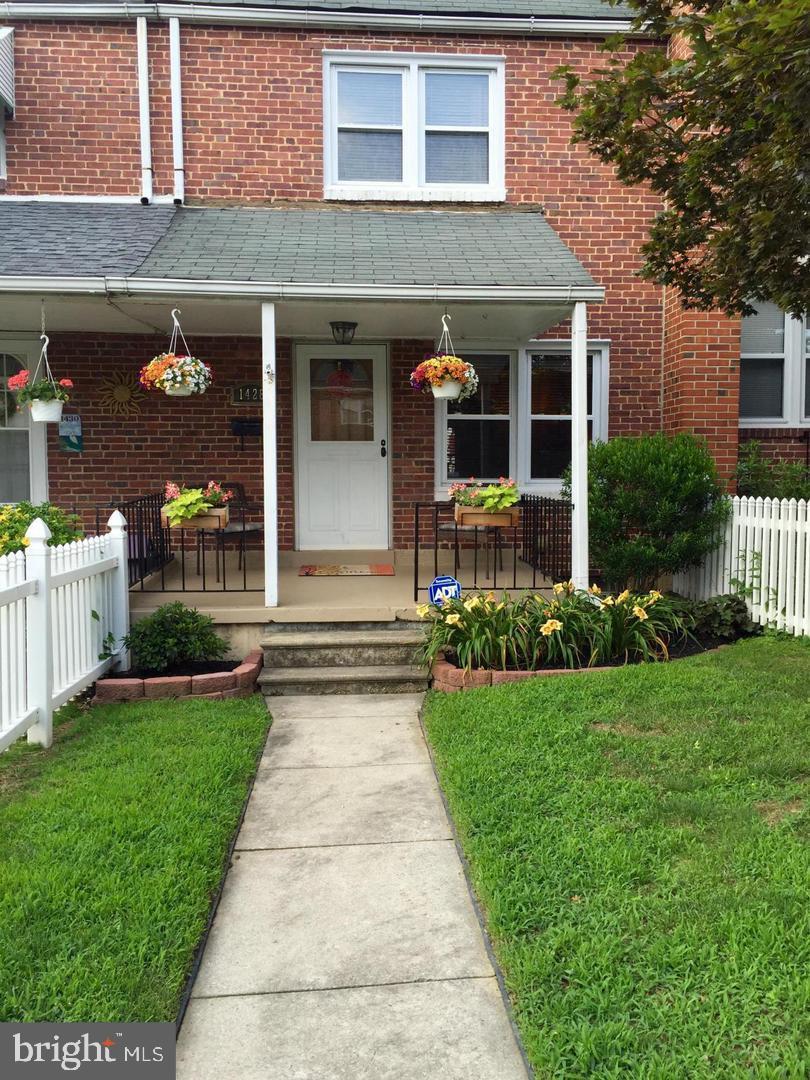 1428 Medfield Ave, Baltimore, MD 21211 - doorway to property featuring a porch and brick siding