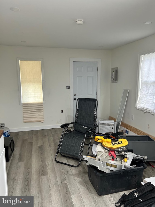 818 Washington St, Cambridge, MD 21613 - sitting room with wood finished floors and a wall mounted AC