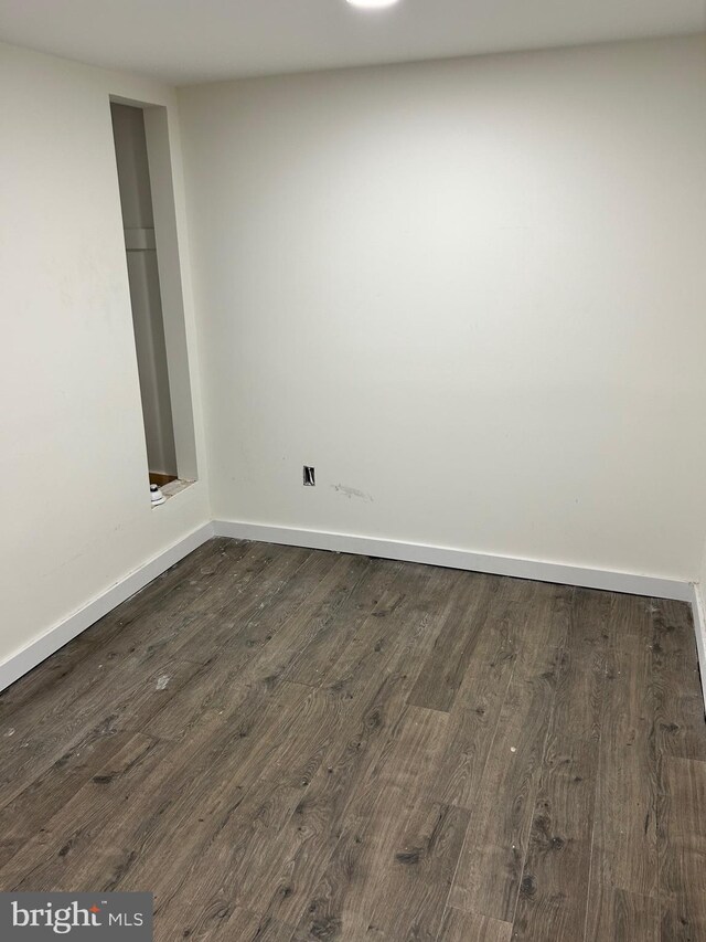 818 Washington St, Cambridge, MD 21613 - empty room featuring dark wood finished floors and baseboards