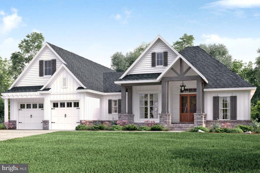 321 Greenwood Rd, Spring Grove, PA 17362 - view of front of house with board and batten siding, a front yard, driveway, and a shingled roof