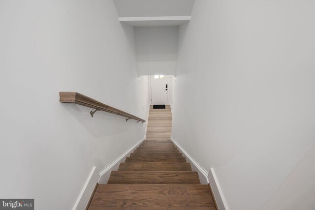 7404 Rocky Creek Ter, Annandale, VA 22003 - staircase with wood finished floors and baseboards