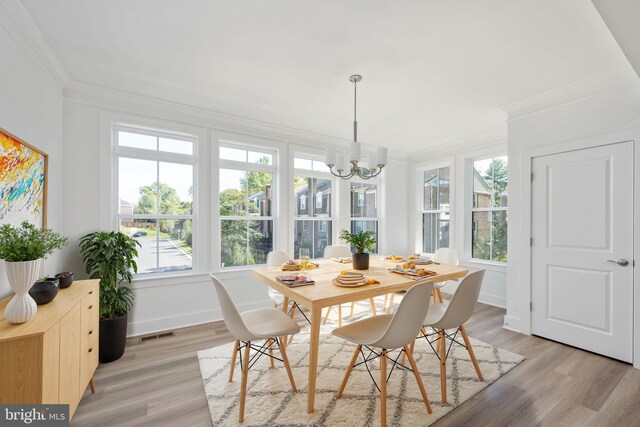 7404 Rocky Creek Ter, Annandale, VA 22003 - dining room featuring crown molding, a chandelier, light wood-style floors, and baseboards