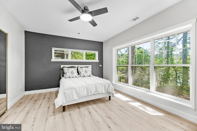 1104 Back Creek Loop Unit 1104, Solomons, MD 20688 - bedroom featuring wood finished floors, baseboards, and a ceiling fan