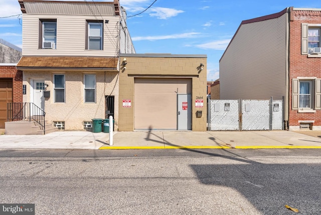 2664 Mercer St, Philadelphia, PA 19125 - view of front facade with a garage, roof with shingles, and cooling unit