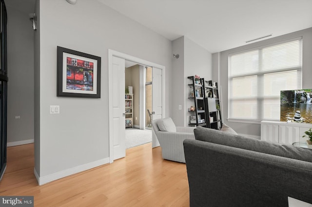 2425 L St NW Unit 623, Washington, DC 20037 - living room with light wood finished floors and baseboards