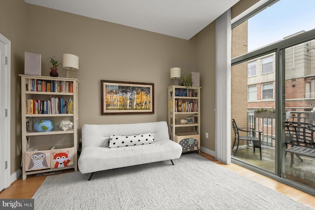 2425 L St NW Unit 623, Washington, DC 20037 - sitting room with healthy amount of natural light, wood finished floors, and baseboards